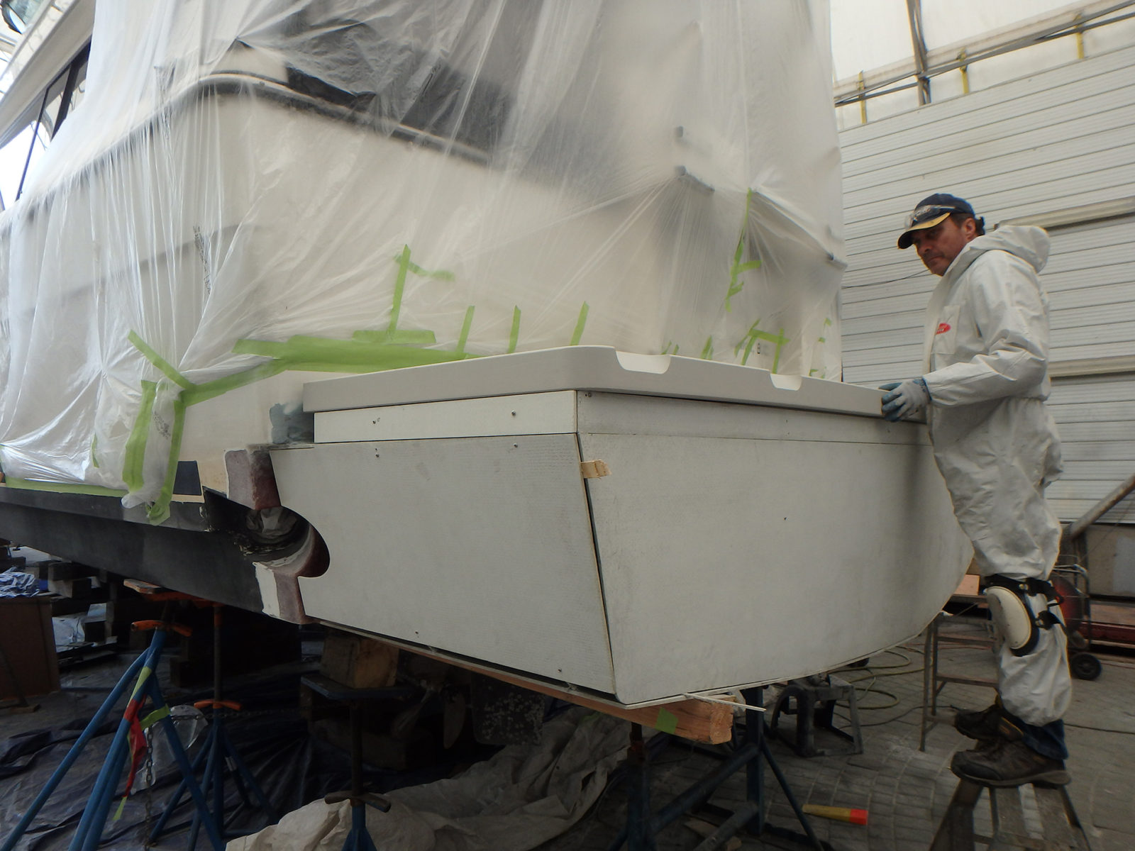  Deon, one of our fiberglassers, getting ready to finish the job 